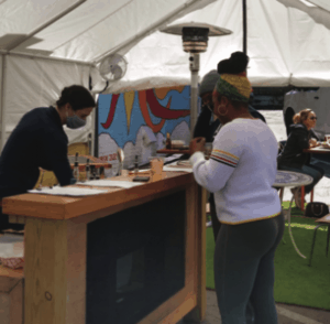 A mano constructed outdoor seating and a bar in its parking lot to accommodate both diners and the various pop-ups it hosts during the pandemic