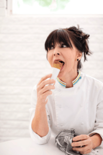 Meridith Ford, Cremalosa gelato shop owner eating an ice cream cone