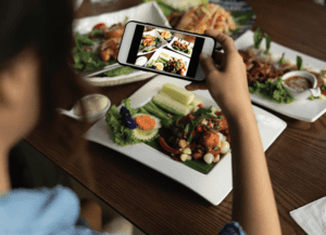 someone taking a picture of their food 