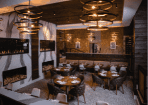 Cuts Steakhouse's Suwanee location features a sunken dining room space. Photo courtesy of Erik Meadows Photography.
