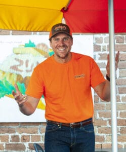 Zunzi and Zunzibar’s co-founder Chris Smith. Photo by Geoff L. Johnson.