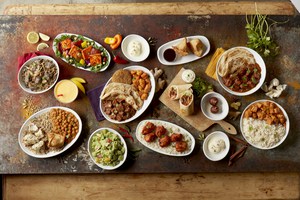 Restaurateur Srinivasa Nimmagadda's food for Sankranti displayed on a wooden table
